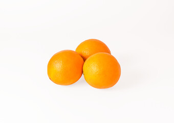 Three oranges on an isolated background