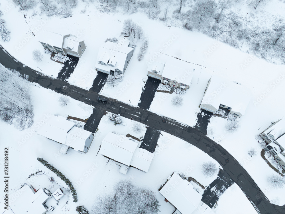 Poster aerial view of residential community after snow storm