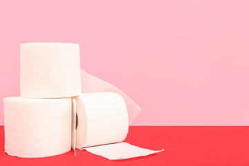Rolls of toilet paper on colorful background