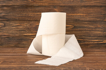 Rolls of toilet paper on wooden background