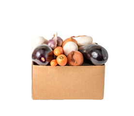 Different vegetables are in a cardboard box