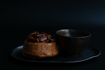 Tasty Dessert , Stcky Bun on Black Background