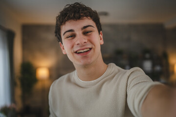 Portrait of teenage boy caucasian teen male young man stand at home