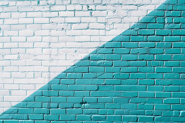 white and turquoise brick wall with a teal shade in t