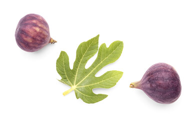 Fresh ripe figs and leaf on white background