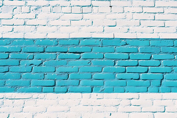 white brick wall with blue and white stripes in