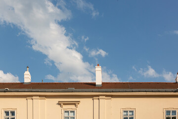 Chimneys on the roof of the house against the sky