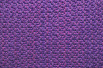 Knitted lilac bright background close-up. Template design.