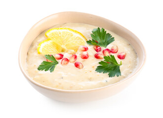 Bowl of tasty baba ghanoush on white background