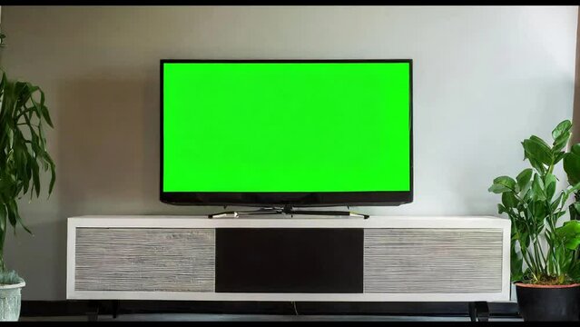 Behold the grandeur of a luxurious living room, adorned with a splendid TV boasting a vibrant green screen, inviting you to unleash your creativity and embark on a visual journey like no other.