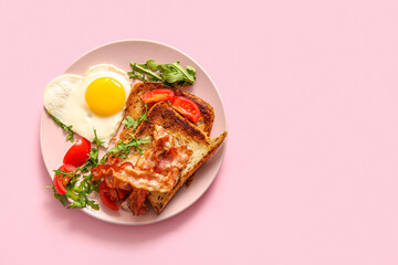 Plate with tasty fried egg, toasts, tomatoes and arugula on pink background