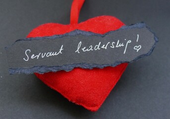 Servant leadership - heart and note with handwriting text