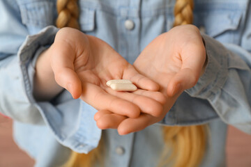 Teenage girl with chewing gums, closeup