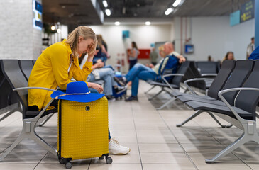 Fototapeta premium Woman missed her flight or it was cancelled.