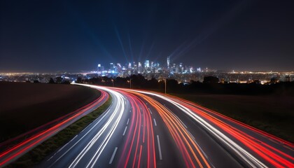 Fototapeta na wymiar Highway long exposure, city skyline in the distance by night 
