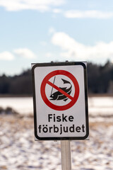 Dalaro, Sweden A sign on a snowy field says in Swedish No Fishing