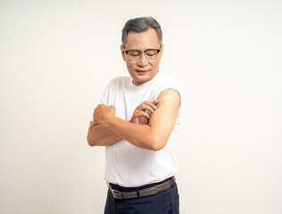 Senior man shows plastered shoulder arm after getting flu influenza vaccine. Mature Old people vaccination immunization. Health care medical.