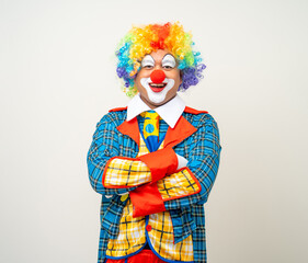 Mr Clown. Portrait of Funny comedian face Clown man in colorful uniform wearing wig standing arms...