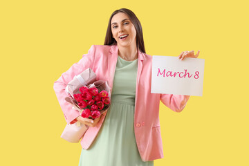 Young woman with card for International Women's Day and tulips on yellow background