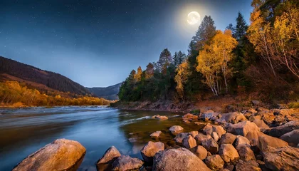 Zelfklevend Fotobehang Bosrivier autumn landscape at night rocky shore of the river that flows near the pine forest at the foot of the mountain in full moon light