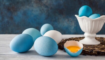 blue eggs with white mig on table - obrazy, fototapety, plakaty