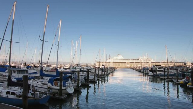 Yacht boats at Pier 39 of SF. Pier 39 is a shopping center and popular tourist attraction built on a pier in San Francisco