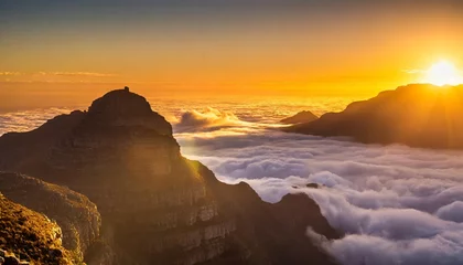 Foto auf Acrylglas Tafelberg golden sunset above clouds mountain view table mountain south africa