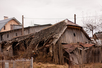 Fototapeta na wymiar a ruined old wooden village house