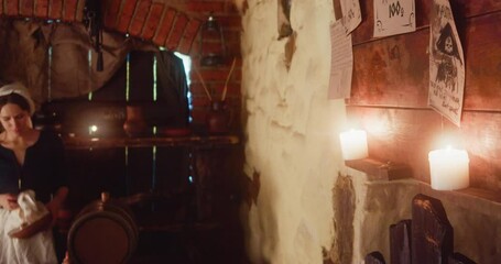 Waitress does dishes and travellers read bulletin board in tavern. Brave men look for job with fantasy beasts while young woman works in guesthouse