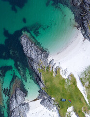 Blue , transparent and clear water Scotland uk near Arisaig Scottish Highlands beautiful white sandy beach Scottish tourist destination located south of Mallaig. Camping spot
