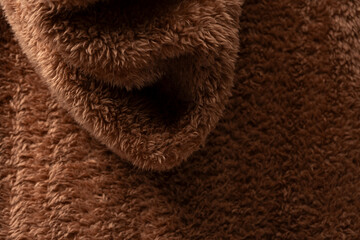 Texture of a brown faux fur as a background.