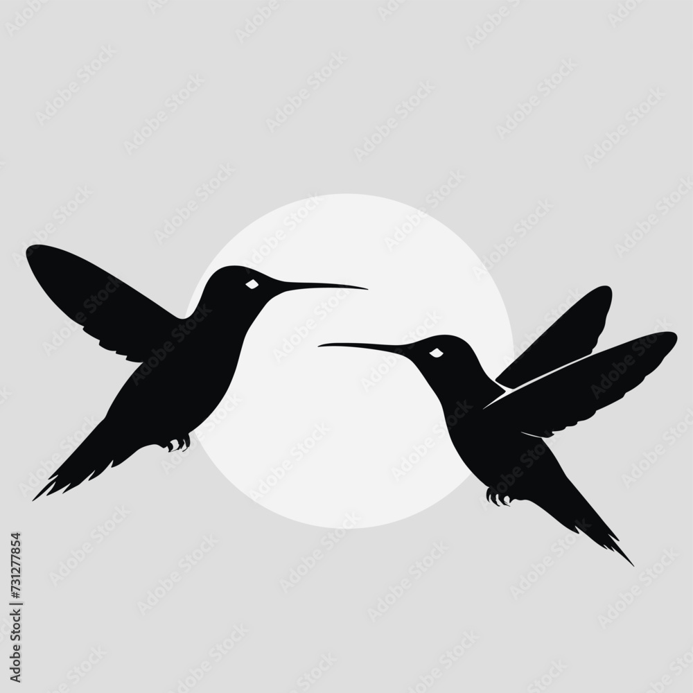 Aufkleber silhouettes of two hummingbirds in mid-flight facing each other against a pale circular background, 