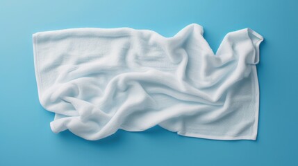 Generating a white beach towel mockup isolated with a clipping path on a blue background in a flat lay top view style