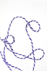 Wrapping Paper Stripy String Rope Close Up on White Background