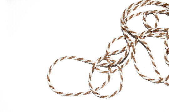 Wrapping Paper Stripy String Rope Close Up on White Background