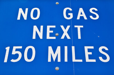 No Gas Next 150 Miles sign in remote western U.S. desert area. 
