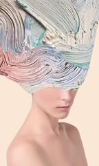 Close-up fashion portrait of beautiful woman with creative art paint splash over face