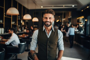 Portrait of a smiling male hairdresser in modern salon