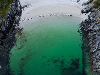 Blue , transparent and clear water Scotland uk near Arisaig Scottish Highlands beautiful white sandy beach Scottish tourist destination located south of Mallaig. Camping spot