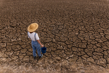 People in middle of dry field, weather problems, drought