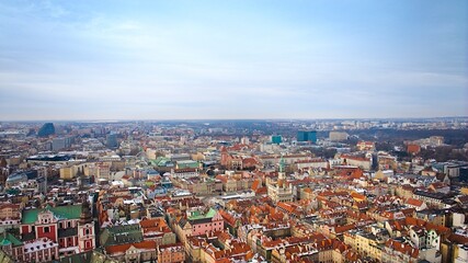 Aerial view of Poznań's historic market square in winter, showcasing the charming old townhouses adjacent to the square.
