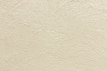 Beige painted stone wall background, abstract texture