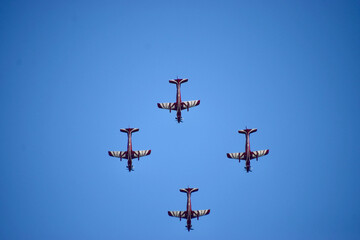 Airshow of aerobatic planes showcasing parachutes paramotor skydiving show with colors  