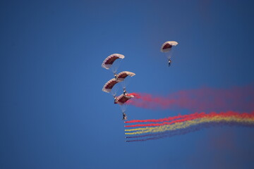 Airshow showcasing parachutes paramotor skydiving show with colors  