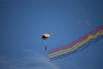 Airshow showcasing parachutes paramotor skydiving show with colors  