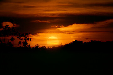 sunset over the hill