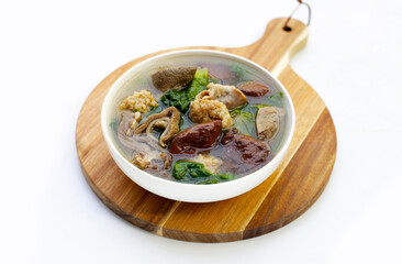 Bowl of pork blood soup on white background.