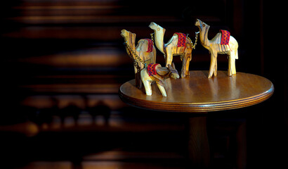 Wooden Figurines of Three Camels and One Donkey