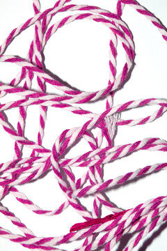 Wrapping Paper Stripy String Rope Close Up on White Background