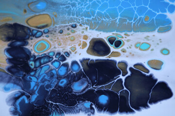 Acrylic pour flow painting blue colors blots. Marble texture. Abstract background.